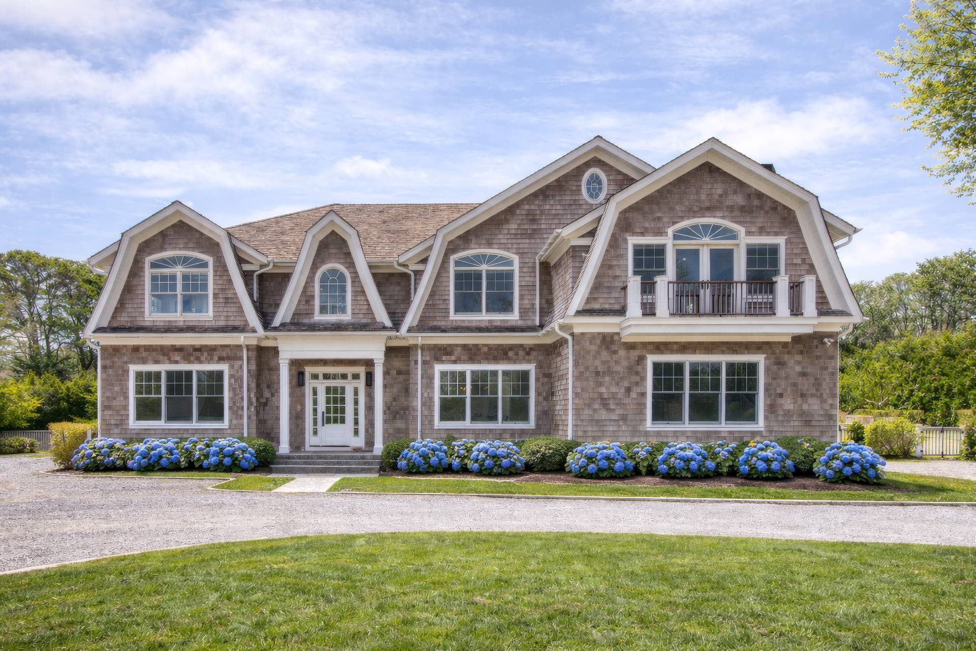 front view of a house next to a yard