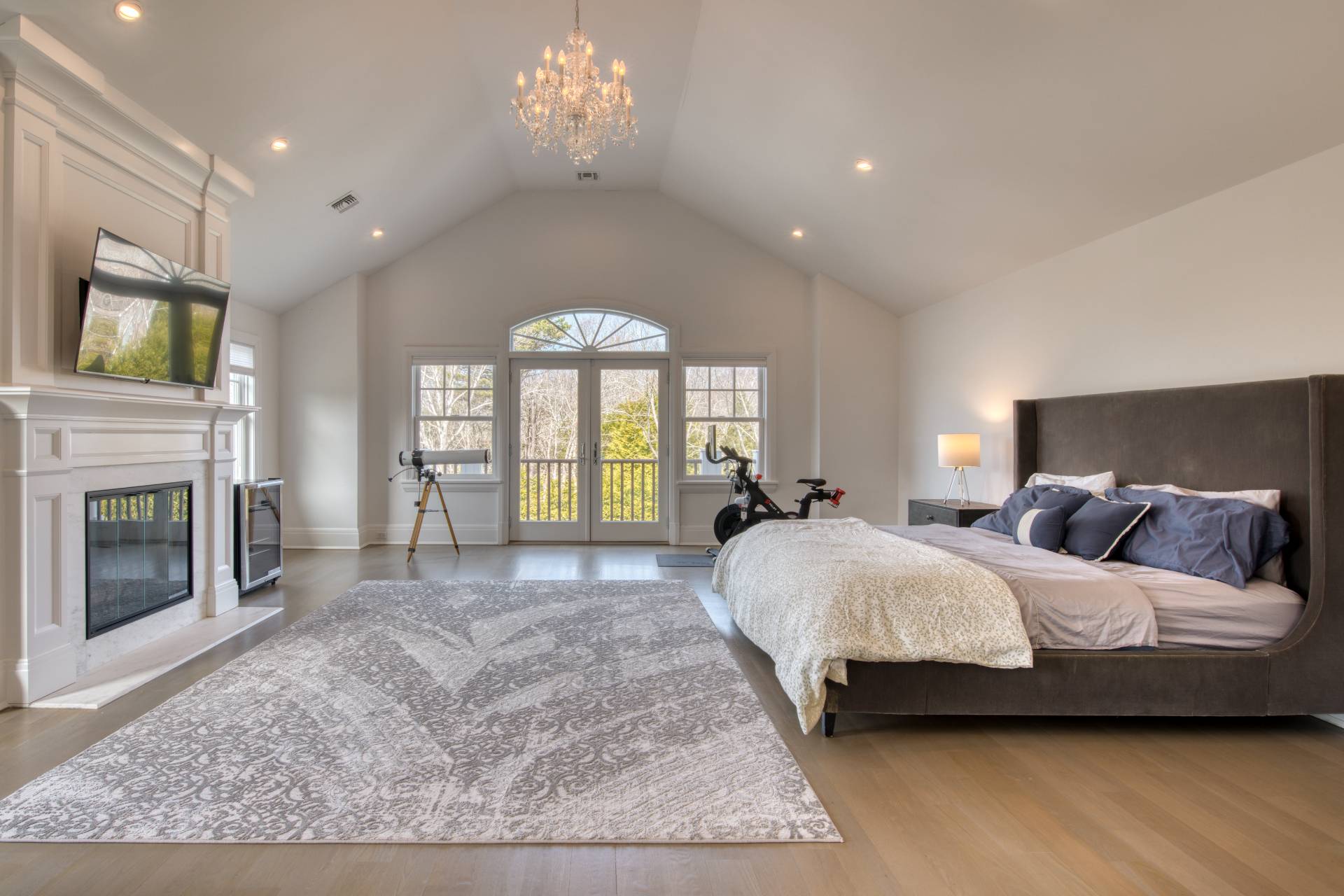 134 Hills Station Road Southampton, NY 11968 - Photo 11 of 33 a spacious bedroom with a bed and a fireplace