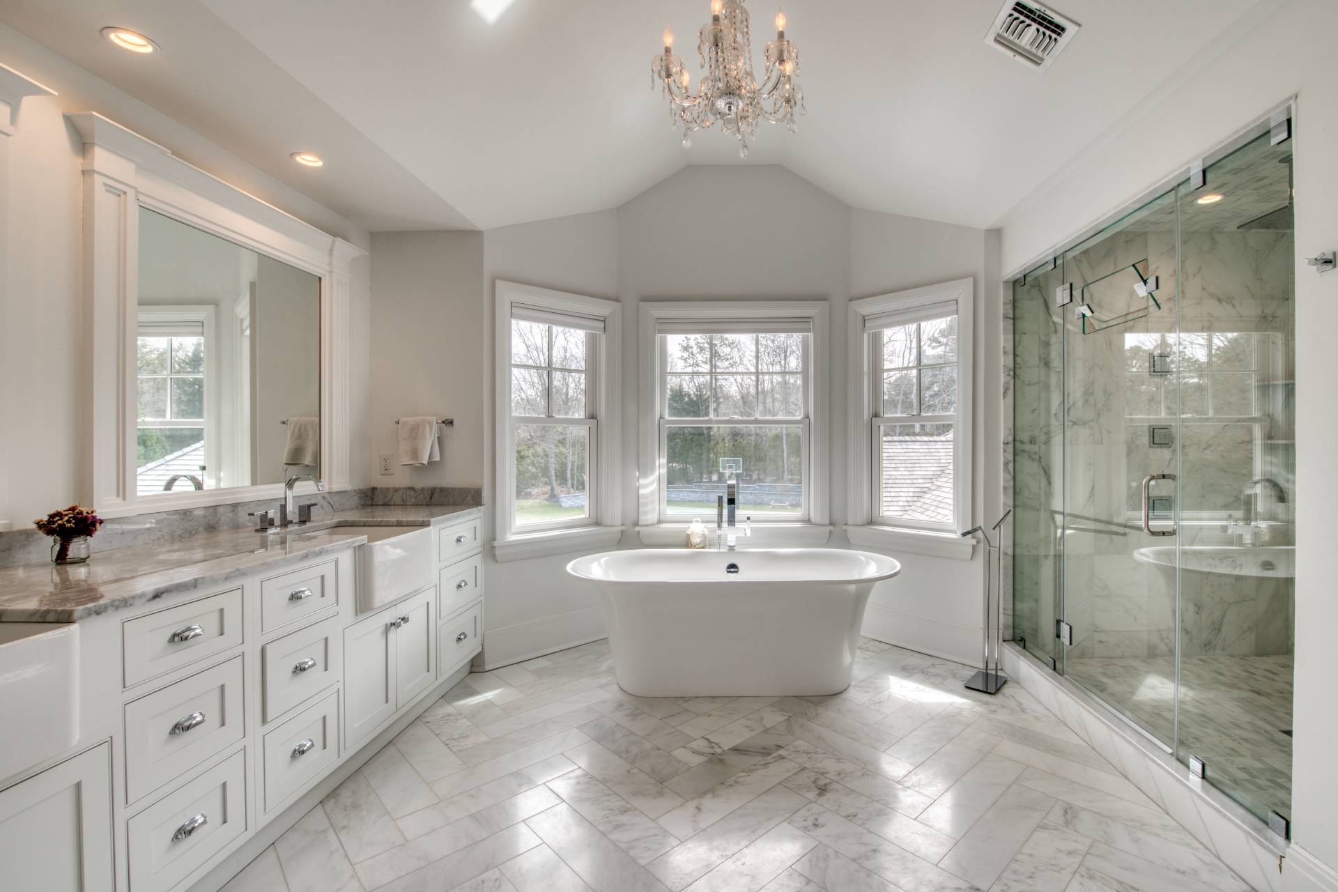 134 Hills Station Road Southampton, NY 11968 - Photo 13 of 33 a bathroom with a sink double vanity mirror and a bathtub