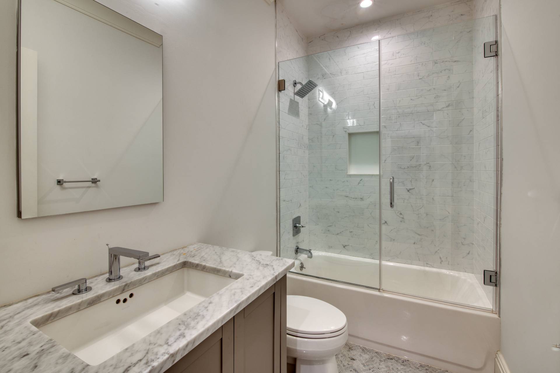 134 Hills Station Road Southampton, NY 11968 - Photo 18 of 33 a bathroom with a granite countertop sink a toilet and shower