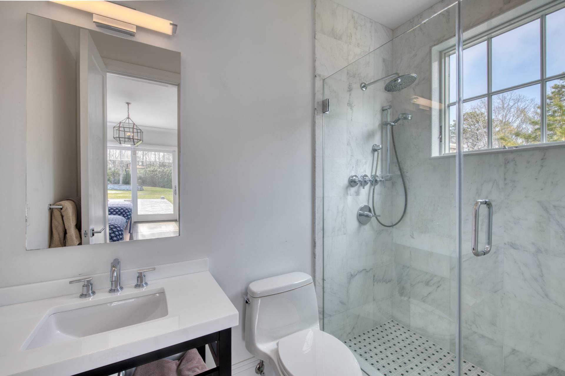 134 Hills Station Road Southampton, NY 11968 - Photo 22 of 33 a bathroom with a sink toilet a mirror and shower