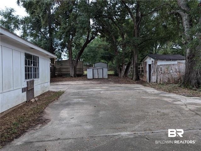 3817 Lansdowne Circle Mobile, AL 36693 - Photo 13 of 16 View of patio with a storage shed