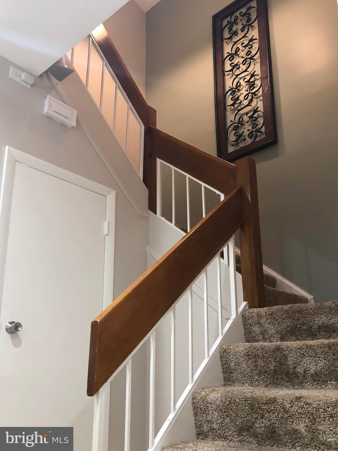 1932 Winterport Cluster Reston, VA 20191 - Photo 26 of 51 Storage under stairs and high ceiling in stairwell