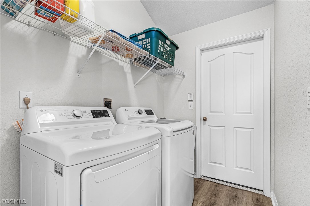 3852 Stabile Road St. James City, FL 33956 - Photo 13 of 27 a utility room with dryer and washer