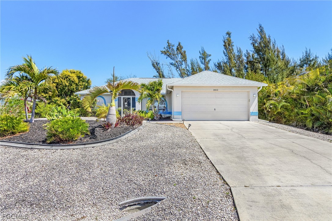 3852 Stabile Road St. James City, FL 33956 - Photo 2 of 27 front view of a house with a yard