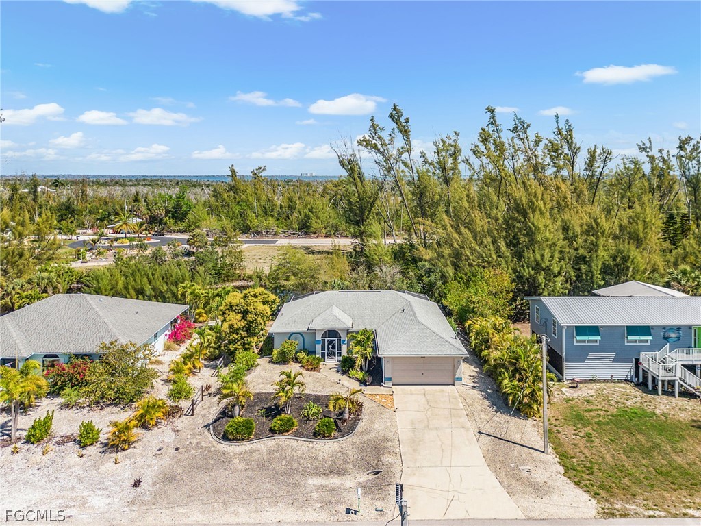 3852 Stabile Road St. James City, FL 33956 - Photo 24 of 27 a view of a swimming pool with a patio and a yard