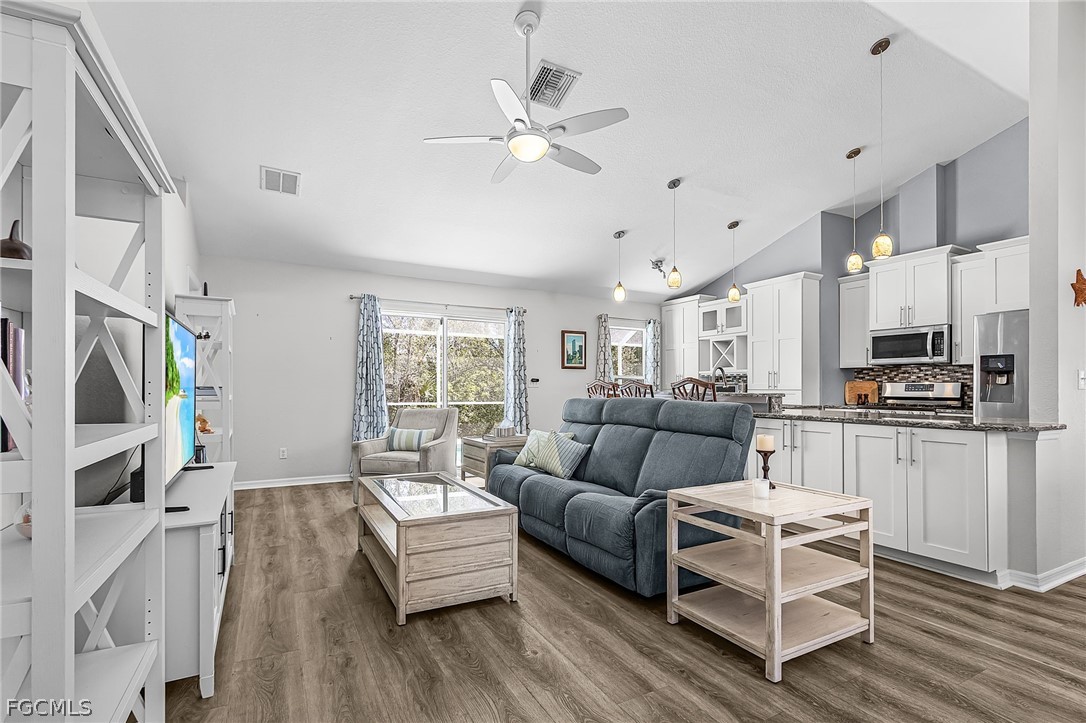 3852 Stabile Road St. James City, FL 33956 - Photo 6 of 27 a living room with furniture and a flat screen tv