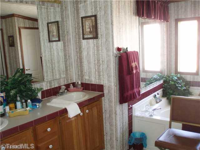 1269 Brims Grove Road Pinnacle, NC 27043 - Photo 7 of 11 Master Bath/Spa. tall double sink vanity plus jetted tub & separate shower