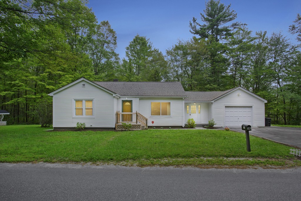 141 Maxwell Road Monson, MA 01057 - Photo 1 of 22 a front view of house with yard and green space