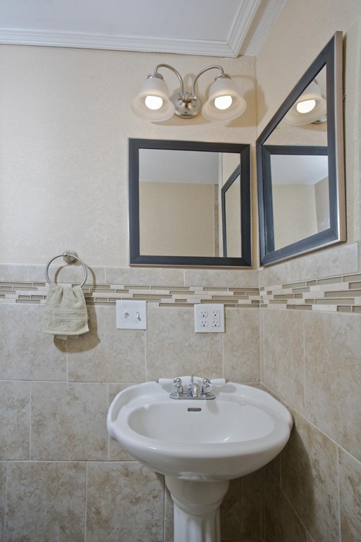 141 Maxwell Road Monson, MA 01057 - Photo 12 of 22 a bathroom with a sink and a mirror