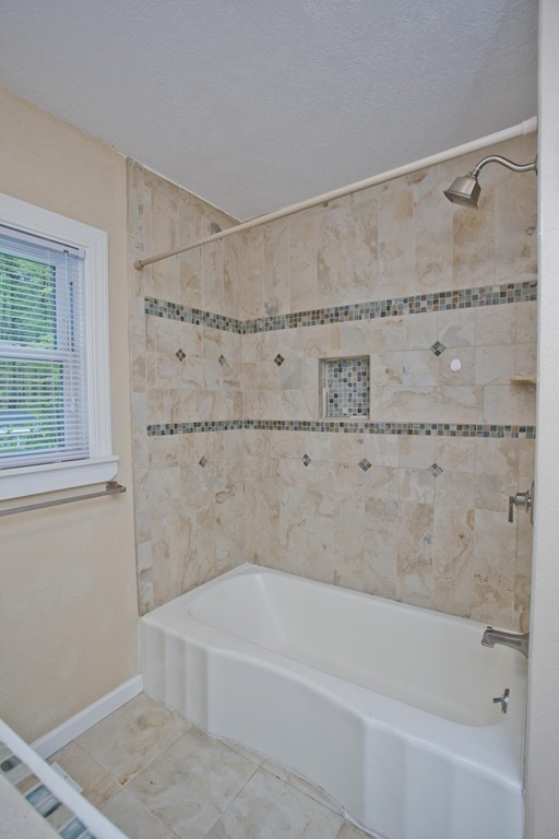 141 Maxwell Road Monson, MA 01057 - Photo 16 of 22 a bathroom with a bathtub and shower