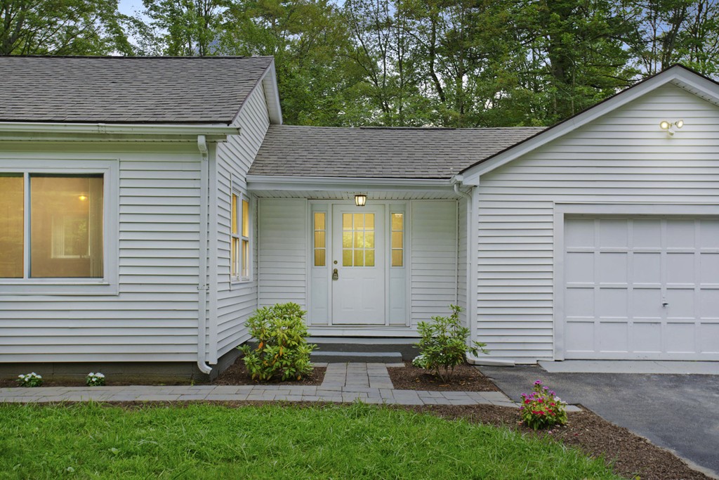 141 Maxwell Road Monson, MA 01057 - Photo 4 of 22 a front view of a house with a yard