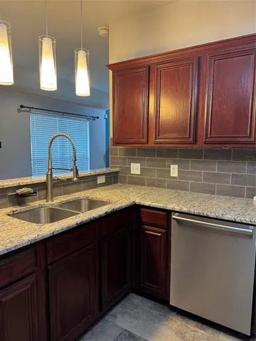 a kitchen with a sink and cabinets