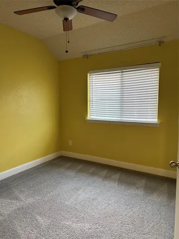 a view of a room with a refrigerator