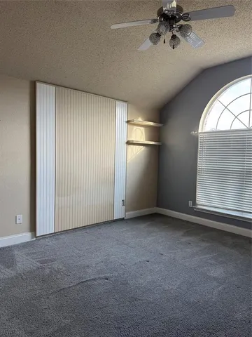 an empty room with a empty space and windows