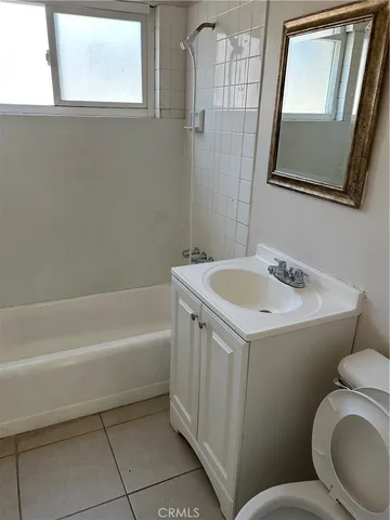 a bathroom with a sink a toilet and a bathtub