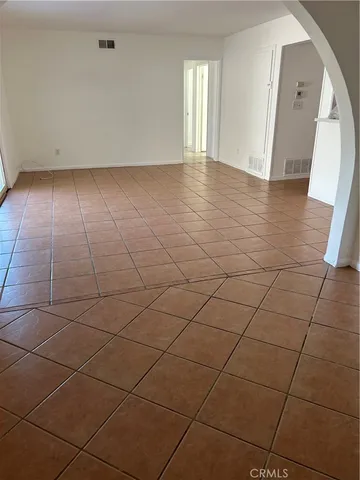 an empty room with white walls