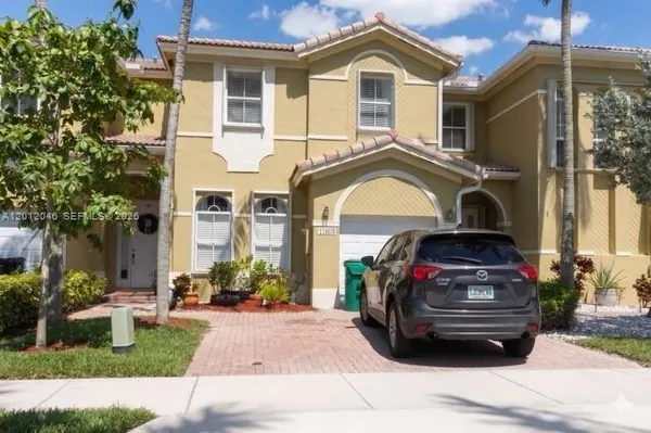 a car parked in front of a house