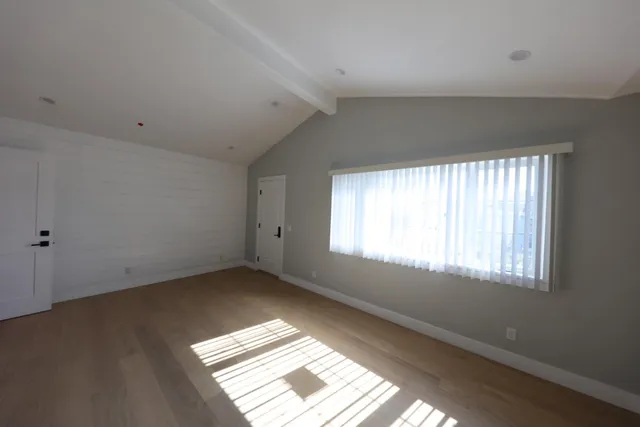 a bathroom with a shower and toilet