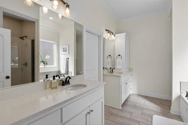 a bathroom with a granite countertop sink mirror and double