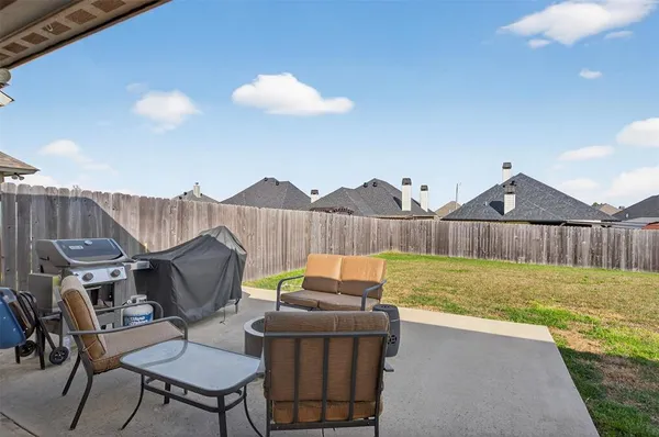 a view of a deck and a yard