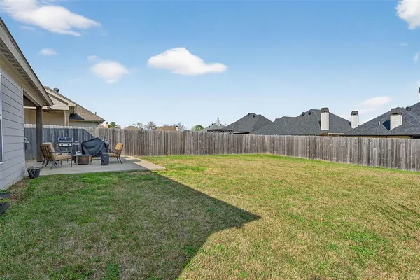 a house view with swimming pool in front of it
