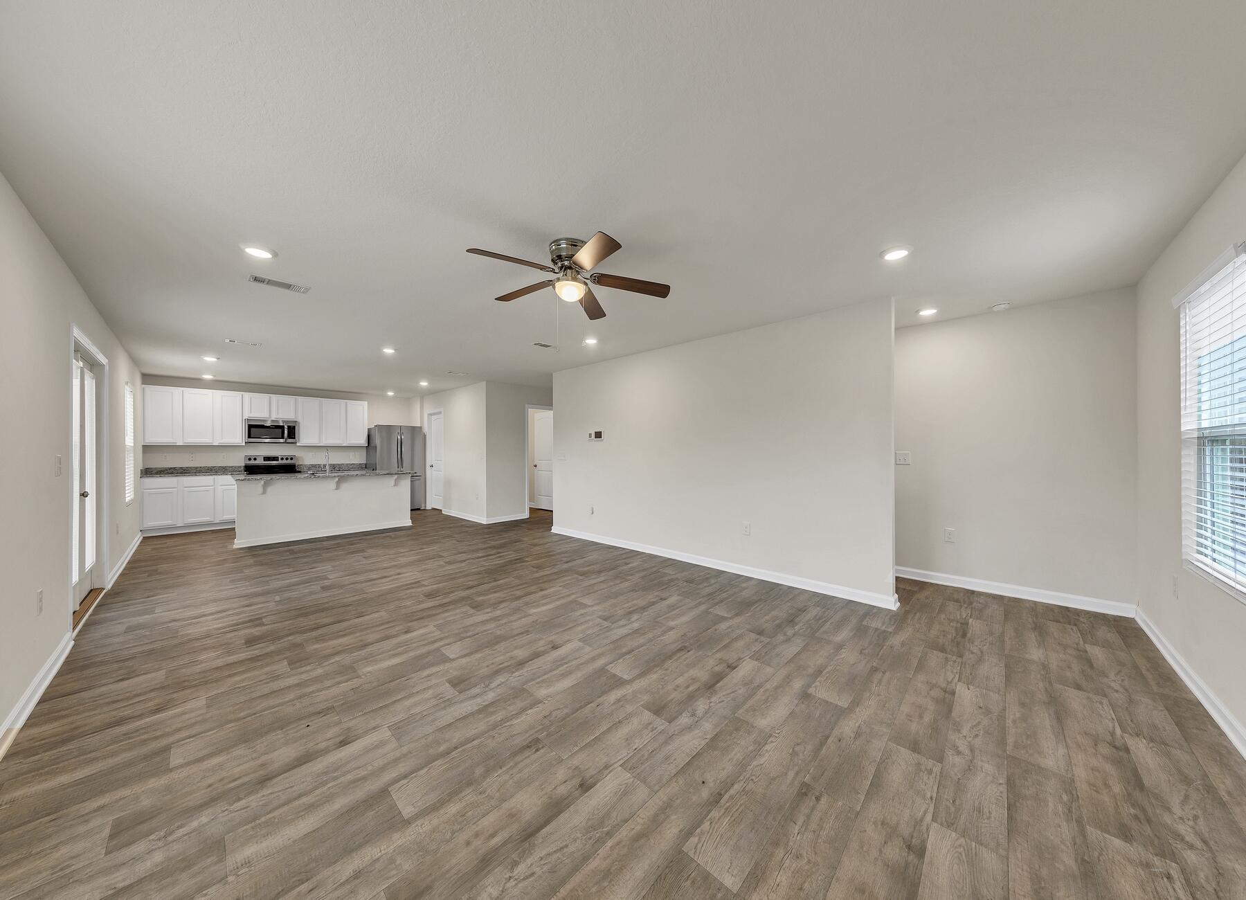 925 Merganser Way Crestview, FL 32539 - Photo 18 of 37 a view of a kitchen with a sink and a refrigerator