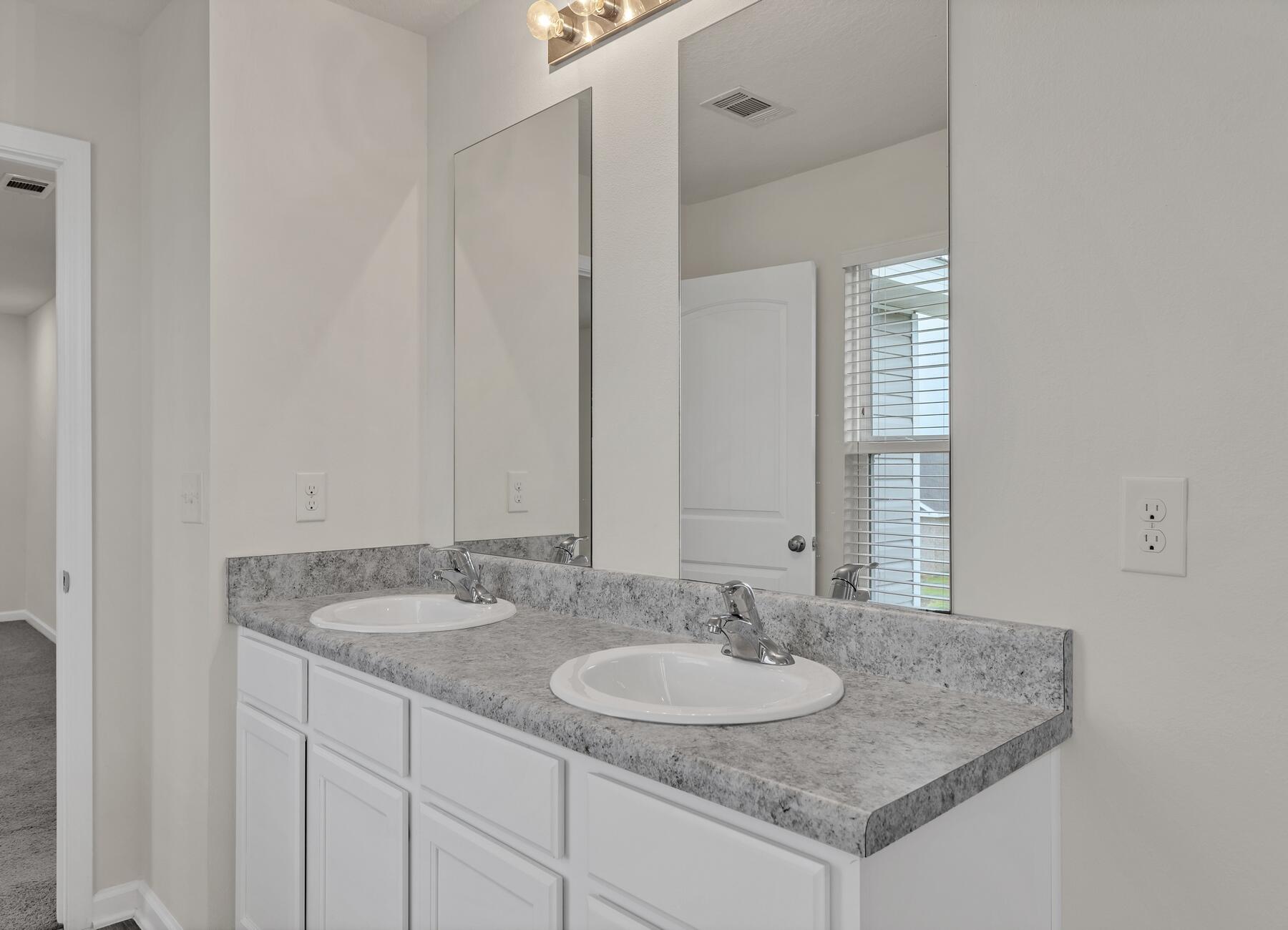 925 Merganser Way Crestview, FL 32539 - Photo 27 of 37 a bathroom with a granite countertop sink and a mirror