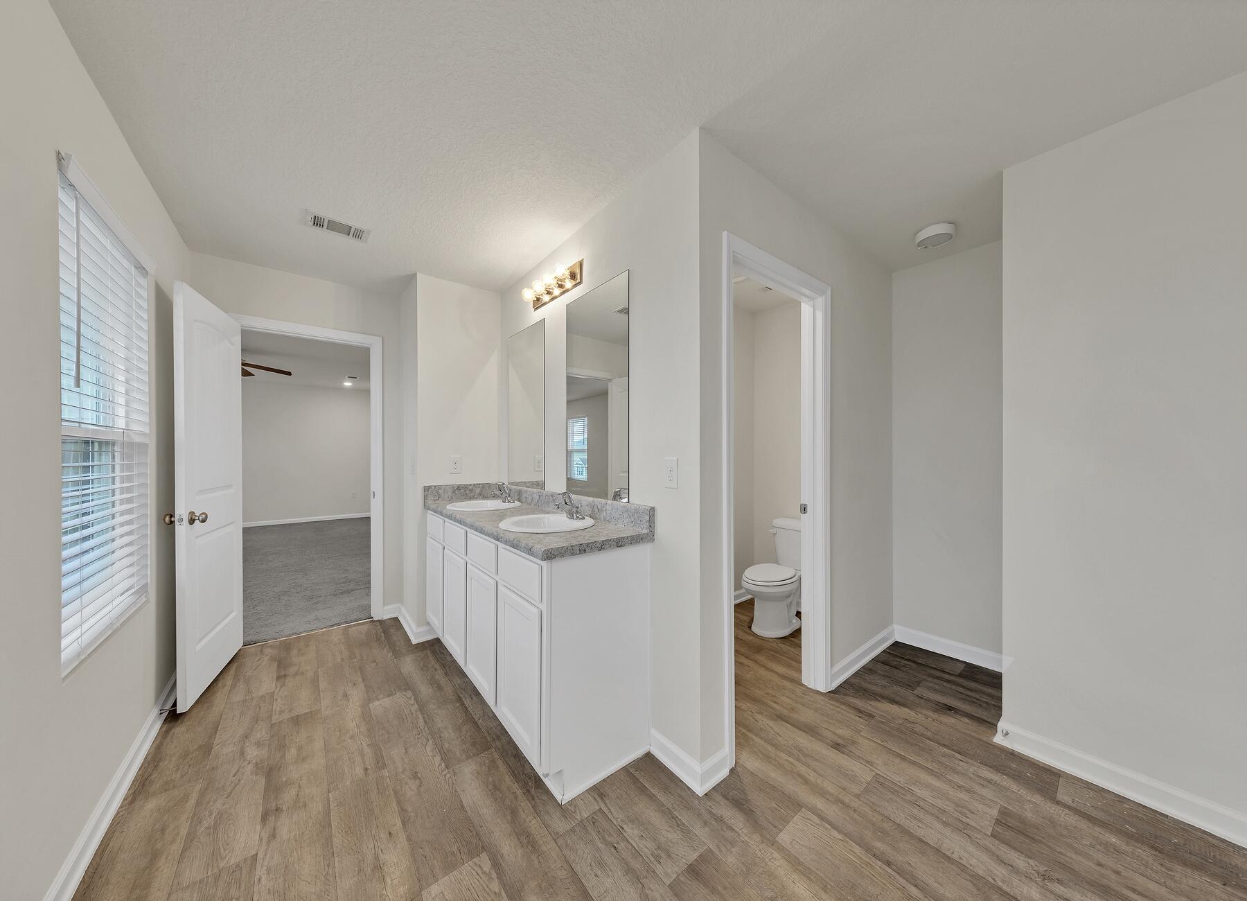 925 Merganser Way Crestview, FL 32539 - Photo 28 of 37 a bathroom with a sink and a mirror