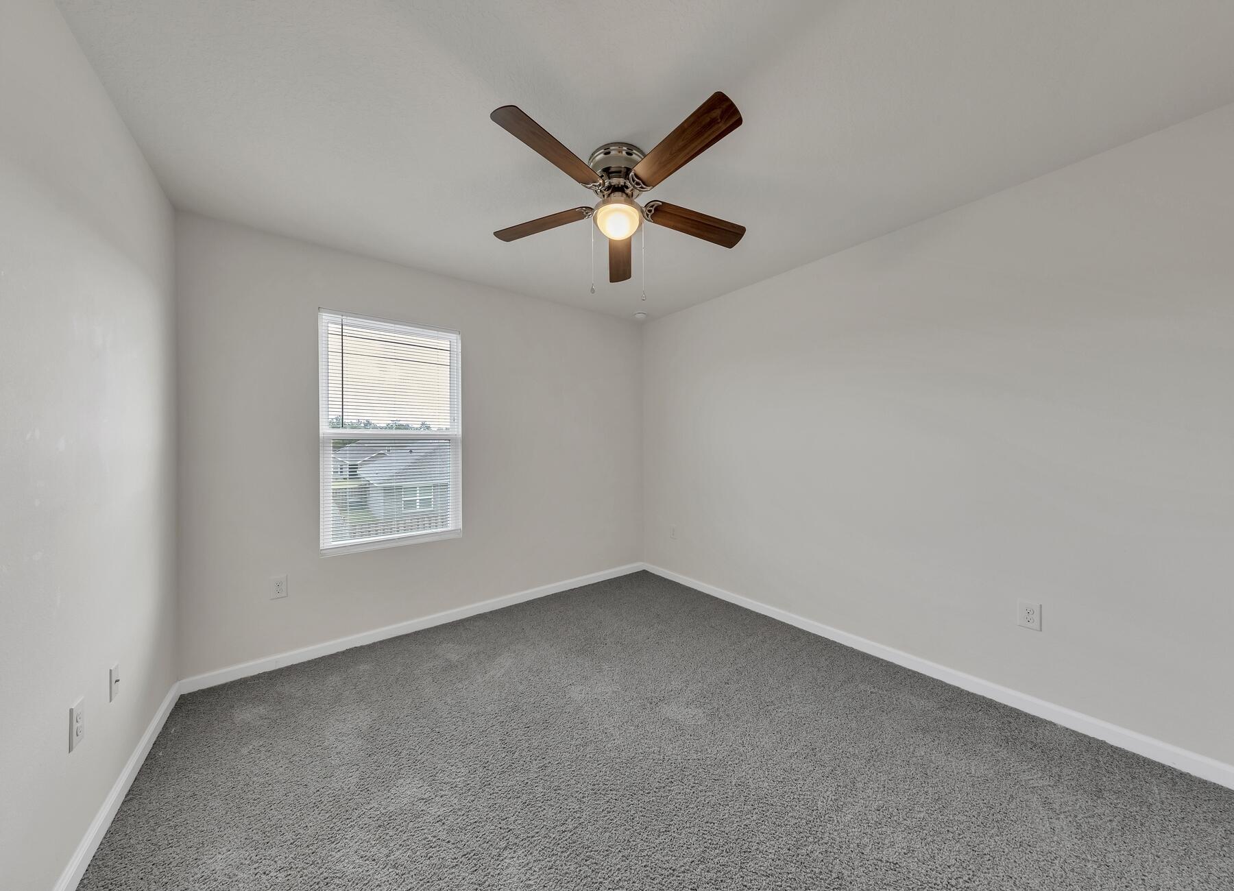 925 Merganser Way Crestview, FL 32539 - Photo 32 of 37 a view of room with window and a ceiling fan