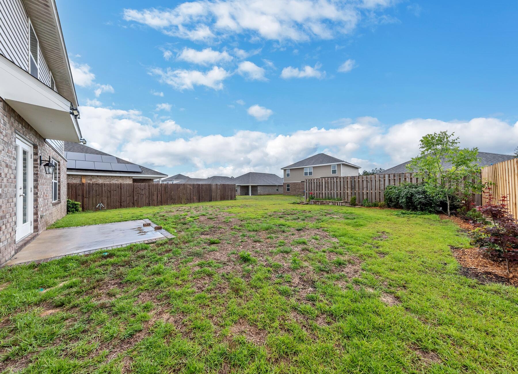925 Merganser Way Crestview, FL 32539 - Photo 37 of 37 a view of a house with a big yard and potted plants
