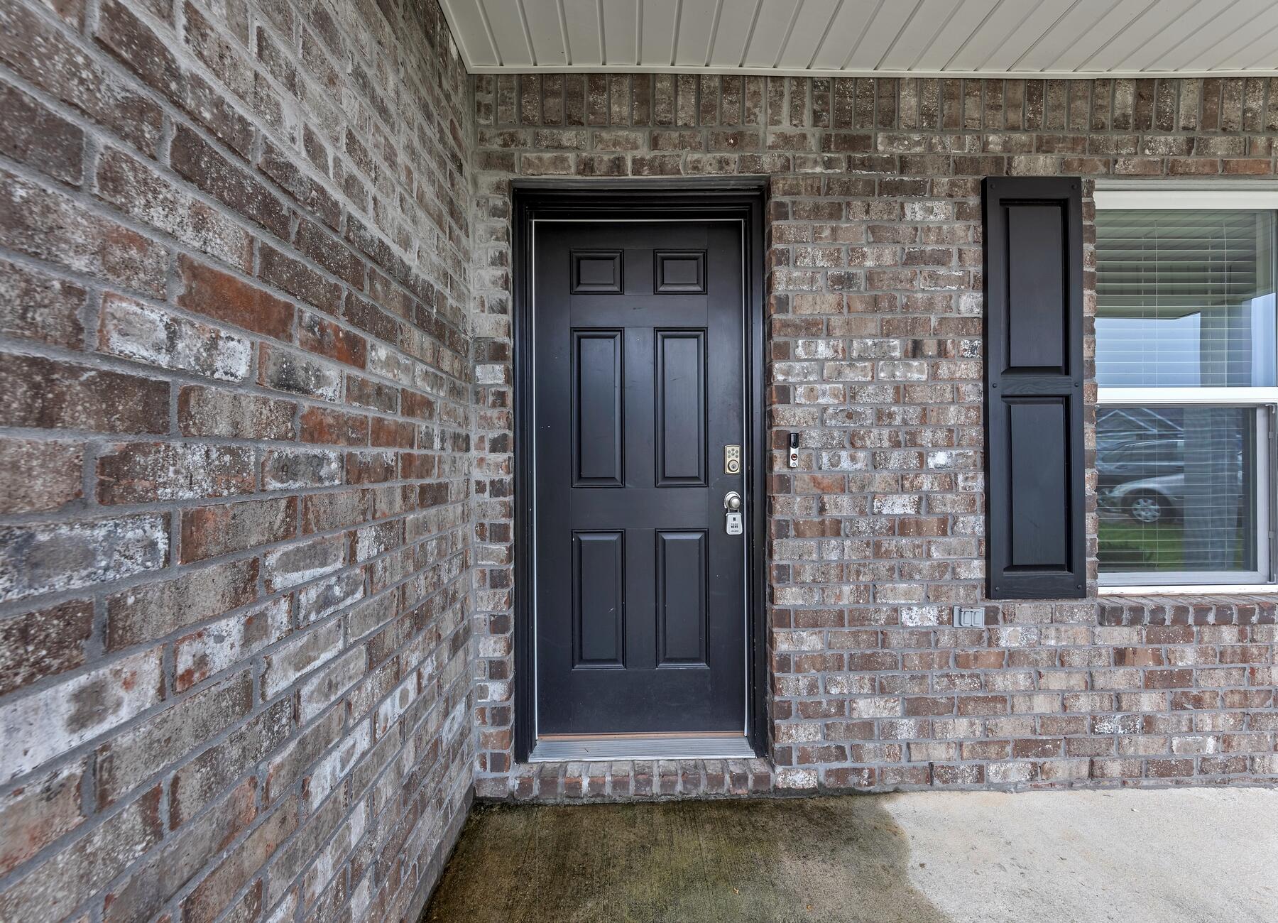 925 Merganser Way Crestview, FL 32539 - Photo 4 of 37 a front view of a house with a door and wooden floor