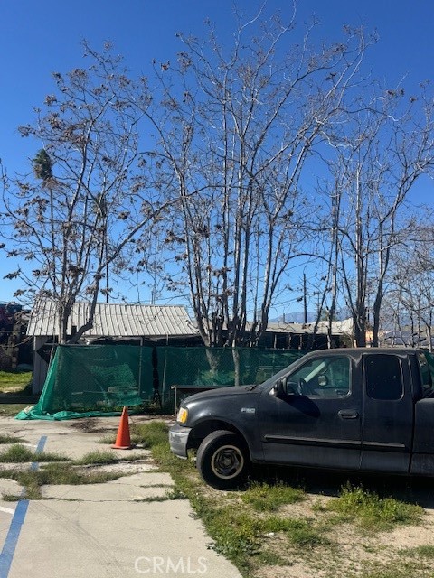 125 East O Street Colton, CA 92324 - Photo 12 of 17 a front view of a house with a garden