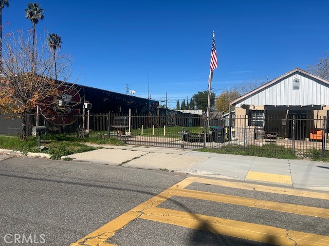 125 East O Street Colton, CA 92324 - Photo 2 of 17 a view of a house in a big yard with plants