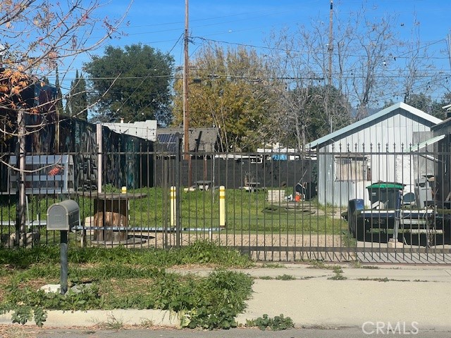 125 East O Street Colton, CA 92324 - Photo 4 of 17 a view of a garden with a slide on the house