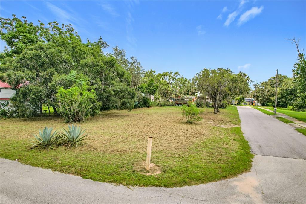 914 Harrell Avenue Frostproof, FL 33843 - Photo 11 of 11 a view of a lake with a yard