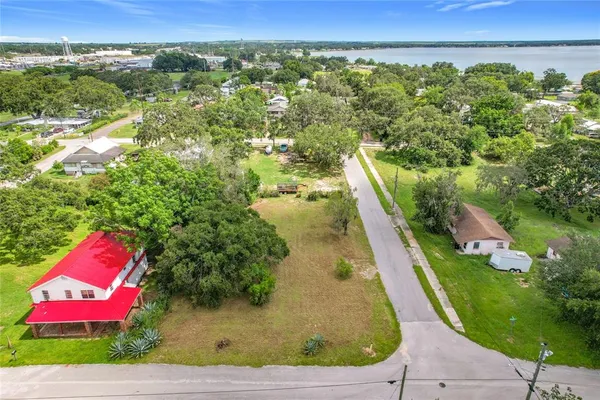 an aerial view of a house with a yard