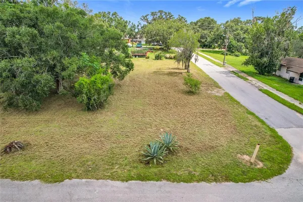 a view of a lake with a yard