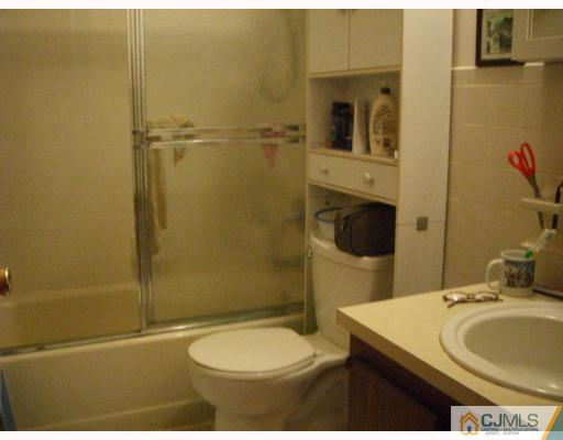 1902 Raspberry Court Edison, NJ 08817 - Photo 6 of 6 a bathroom with a sink toilet and shower
