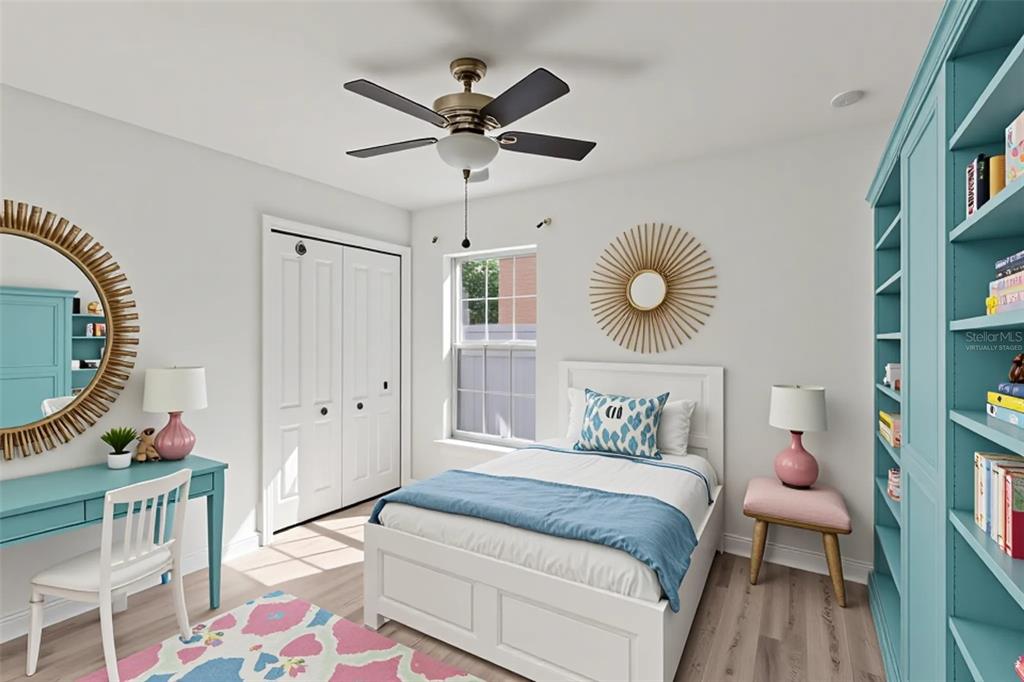 109 James Circle Lake Alfred, FL 33850 - Photo 4 of 17 a bedroom with a bed and a chandelier