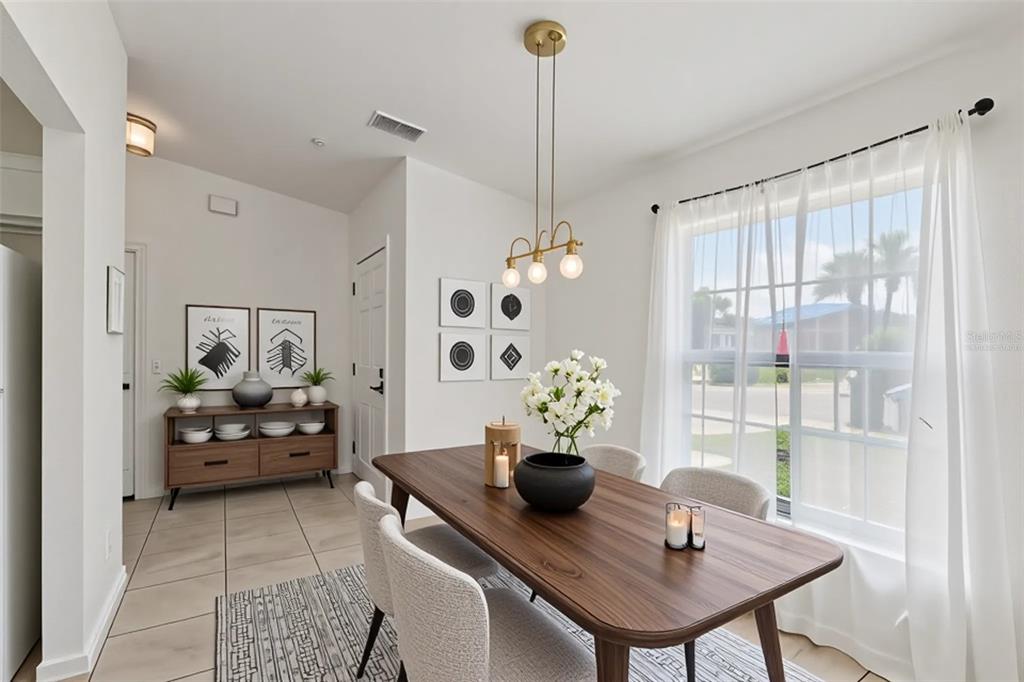 109 James Circle Lake Alfred, FL 33850 - Photo 5 of 17 a living room with furniture and a table