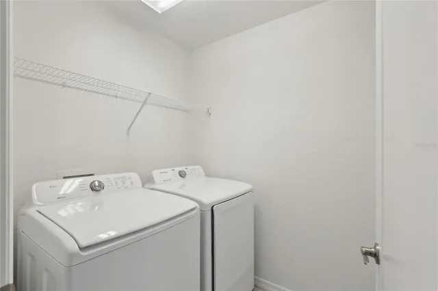 a utility room with dryer and washer