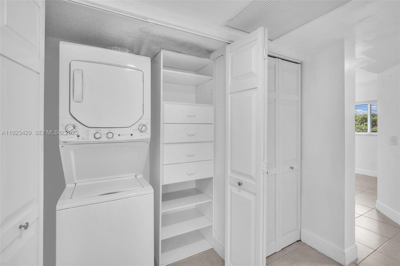 701 Southwest 142nd Avenue, Unit 414S Pembroke Pines, FL 33027 - Photo 28 of 30 a view of walk in closet with empty racks