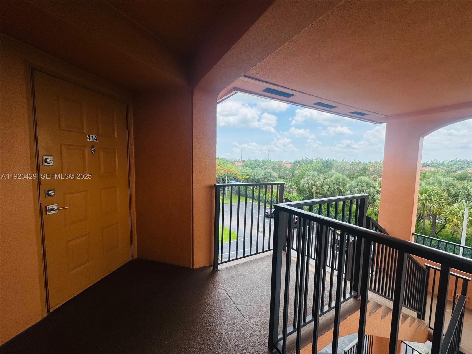 701 Southwest 142nd Avenue, Unit 414S Pembroke Pines, FL 33027 - Photo 7 of 30 a view of a balcony with wooden floor