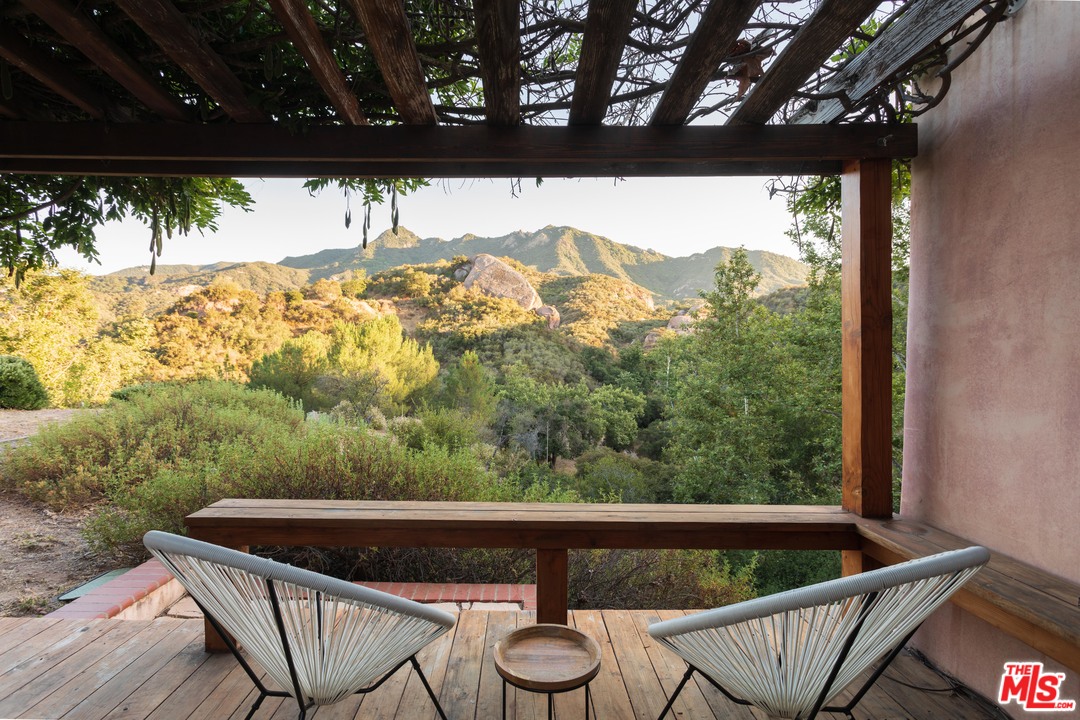 23407 Red Rock Road Topanga, CA 90290 - Photo 3 of 41 a view of a back yard from a balcony