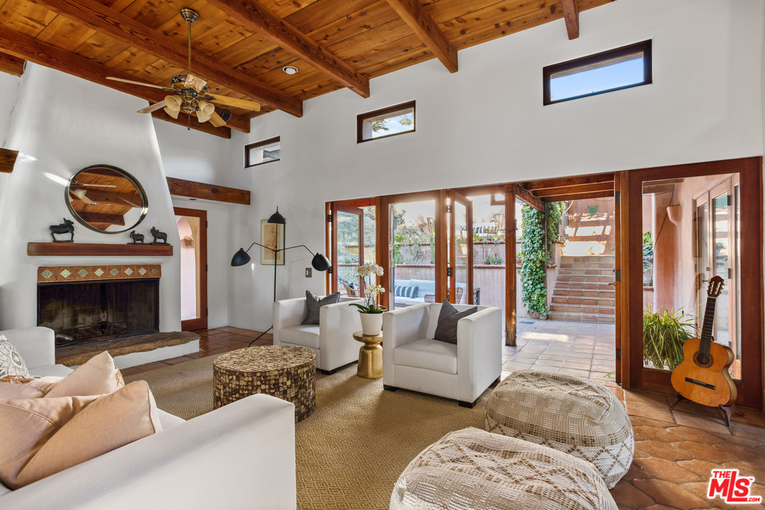 23407 Red Rock Road Topanga, CA 90290 - Photo 4 of 41 a living room with furniture and a fireplace