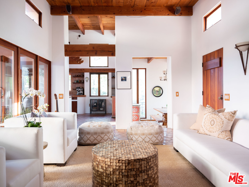 23407 Red Rock Road Topanga, CA 90290 - Photo 6 of 41 a living room with furniture and a large window