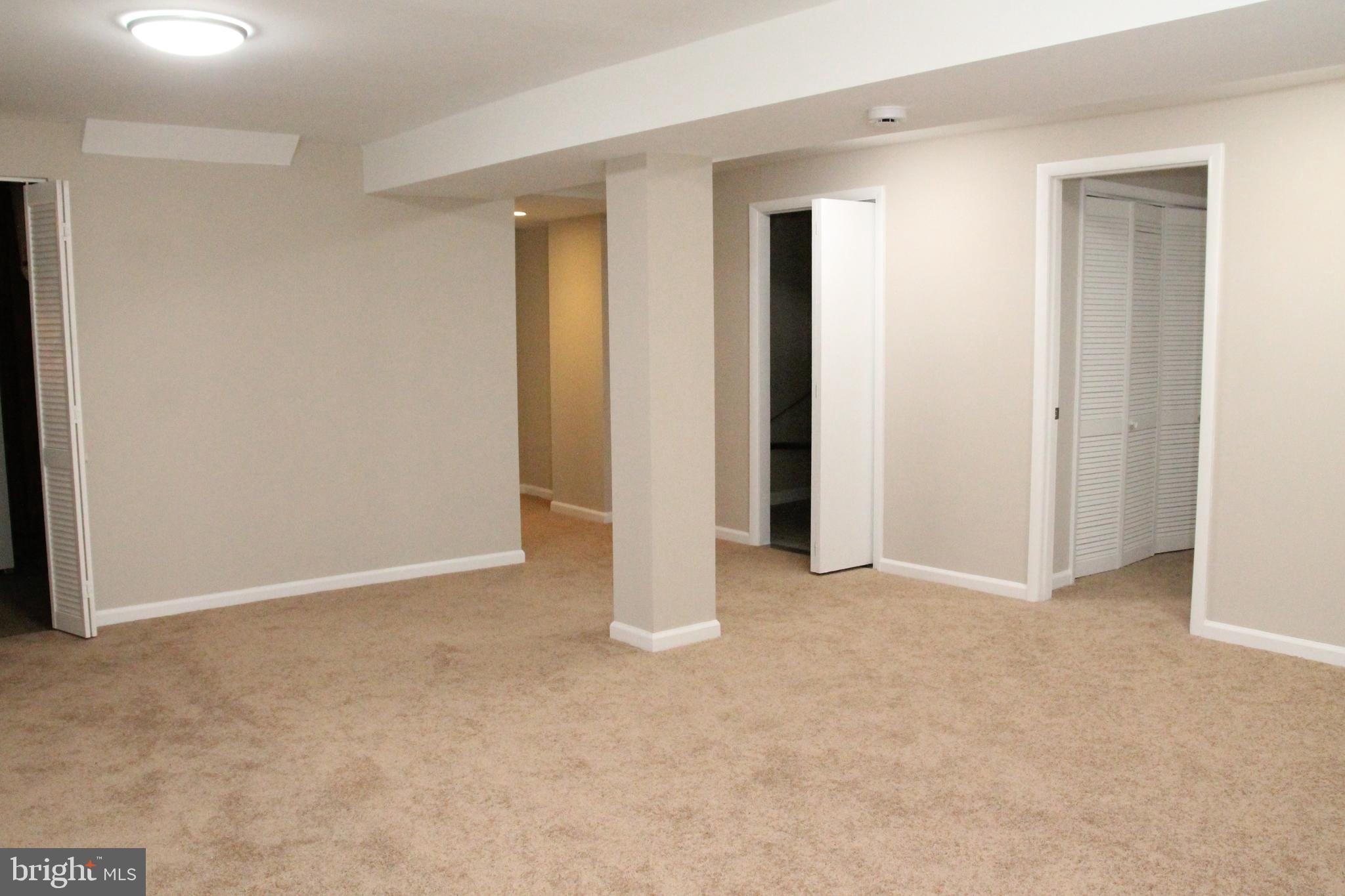 7911 Hart Road Fort Washington, MD 20744 - Photo 34 of 49 an empty room with closet and mirror