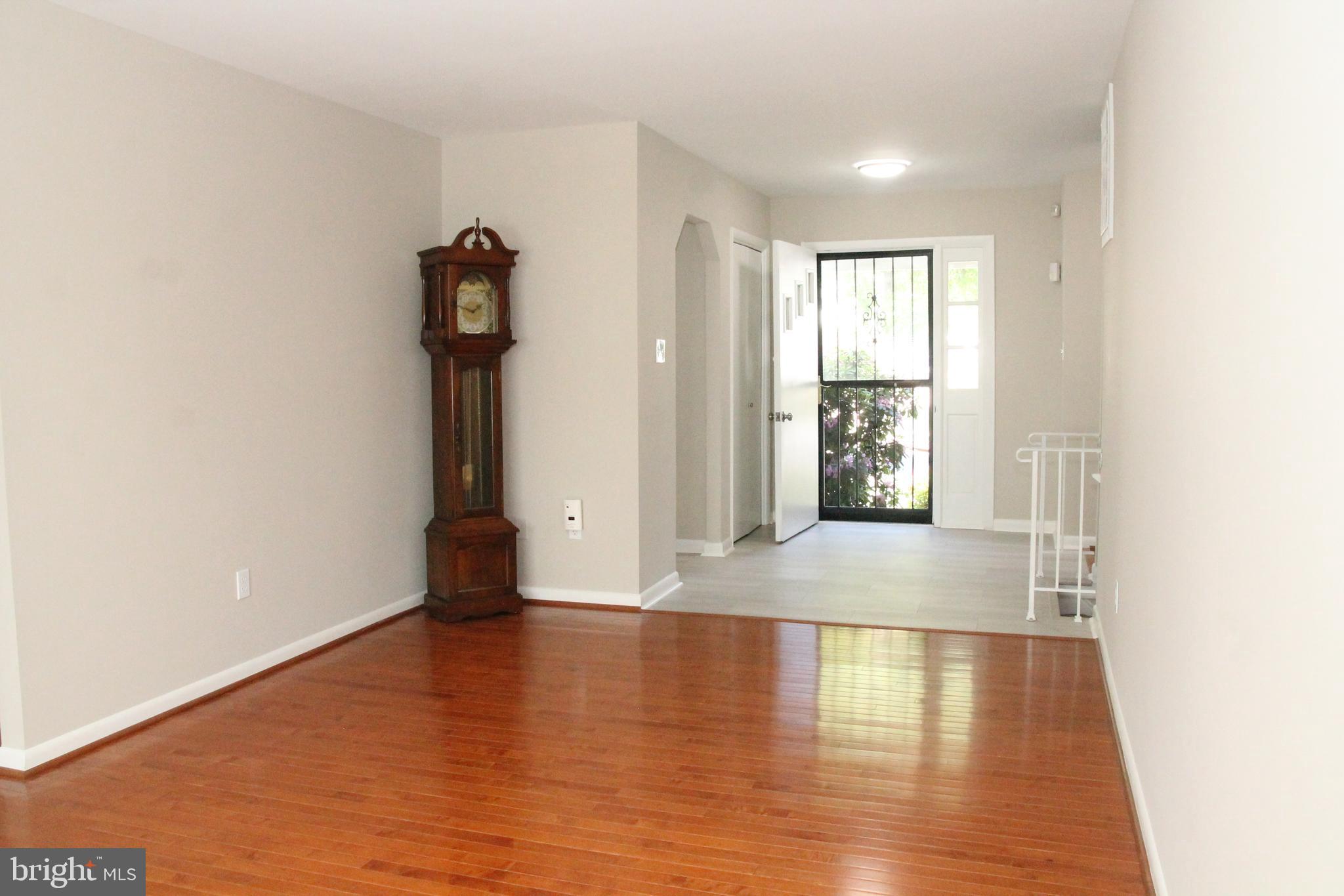 7911 Hart Road Fort Washington, MD 20744 - Photo 4 of 49 a view of an empty room with window and wooden floor