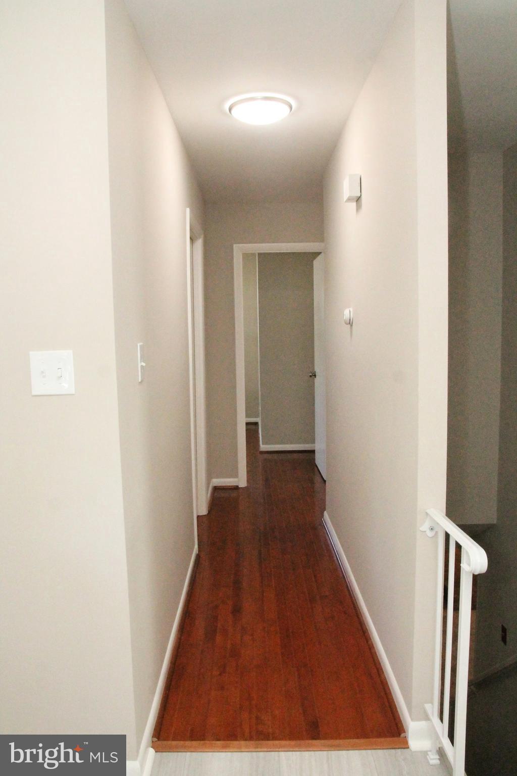 7911 Hart Road Fort Washington, MD 20744 - Photo 10 of 49 a view of a hallway with wooden floor
